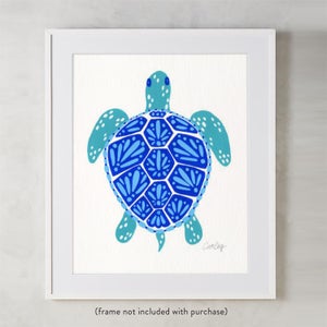 May include: A blue and white patterned sea turtle illustration. The turtle is facing forward with its shell facing the viewer. The shell is a geometric pattern of blue and white.