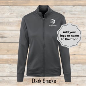 May include: Dark smoke-colored zip-up jacket with a high collar. The jacket features a white horse logo and the text "Customize with your logo." The text "Add your logo or name to the front" is also present. The words "Dark Smoke" are at the bottom.