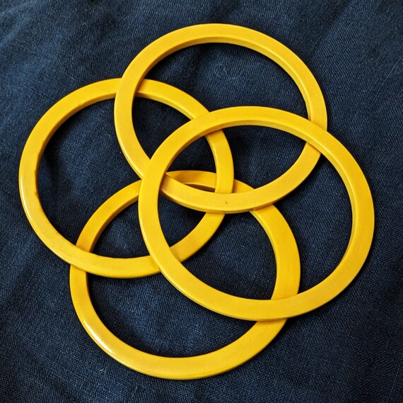 Four thin square edged yellow Bakelite bracelets.… - image 3
