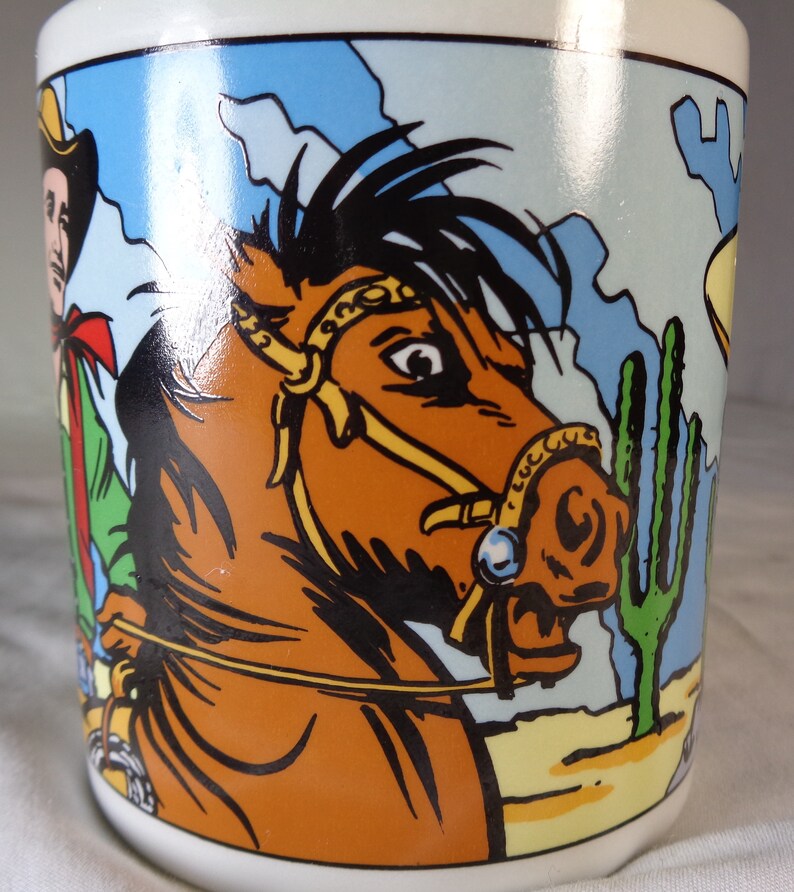 Two Wild Wild West Vandor Cowboy Coffee Mugs.