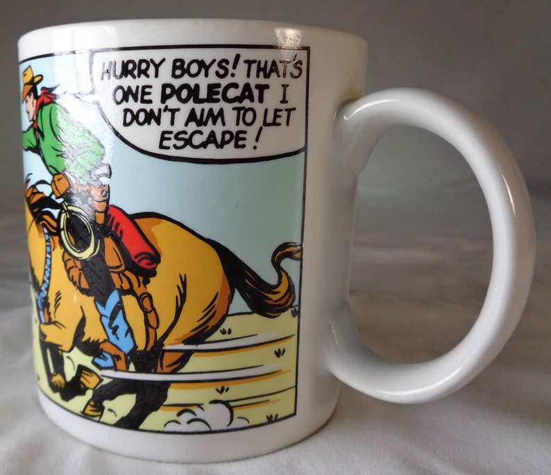 Two Wild Wild West Vandor Cowboy Coffee Mugs.