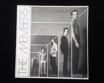 Disco de vinilo británico 45 "Solitary Confinement" de The Members. 1978. Punky