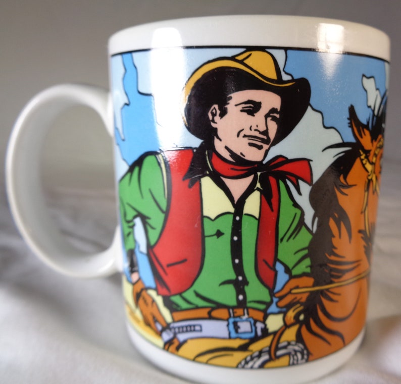 Two Wild Wild West Vandor Cowboy Coffee Mugs.