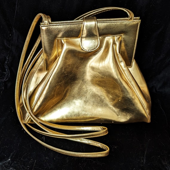 Gold shoulder bag. Largish. Snap top, roomy inside