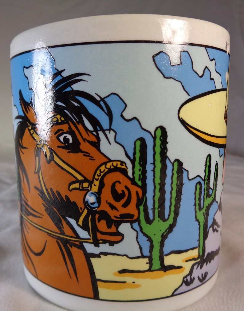 Two Wild Wild West Vandor Cowboy Coffee Mugs.