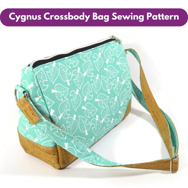 May include: A teal crossbody bag with a white leaf pattern and a brown cork strap. The bag has a zipper closure and a metal ring on the strap.