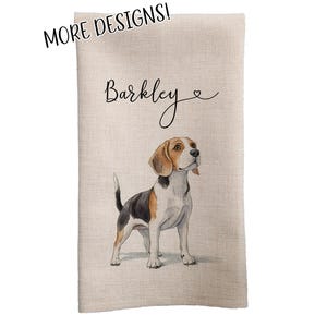 May include: A beige kitchen towel with the name "Barkley" written in black cursive script and a small heart symbol. A watercolor illustration of a beagle dog is in the bottom center of the towel.