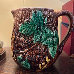Antique Majolica Pitcher With A Wooland Background