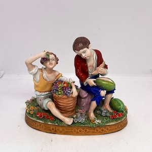 Sitzendorf Figure Of Two Children Sitting  In A Garden Eating Fruit