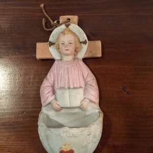 Holy Water Font Of Jesus In Front Of The Cross