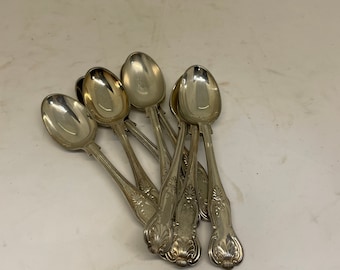 Eight Silver Plate Spoons From England