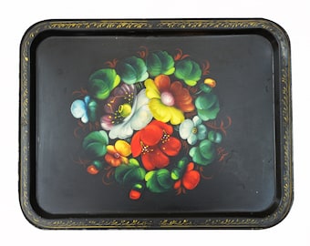 May include: A black metal serving tray with a gold painted border and a hand-painted floral design in shades of red, yellow, green, blue, and white.