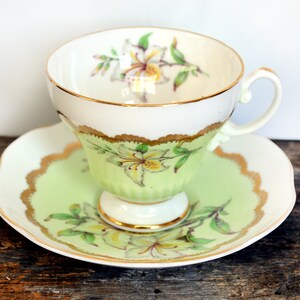 Vintage Green Foley teacup, Easter Lily Pattern, Bone China Cabinet Duo circa 1940s, Adorned inside and out Trimmed in Gold made in England