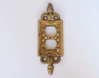 Vintage ornate brass double outlet cover, Hollywood Regency Design with intricate details, home renovation outlet covers