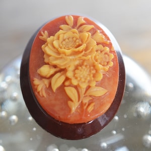 Vintage Shell carved floral cameo brooch circa 1930s, carved and set upon a larger resin disc, rustic primitive jewelry