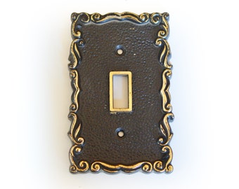 Vintage Black and gold plastic single switch cover or switchplate, circa 1970s, Hollywood Regency Design with ornate swag edges