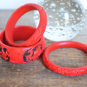 Vintage Chinese Cinnabar Bracelets, Set of 3, Dragon and floral motifs, Intricately carved cinnabar bangles, Asian jewelry