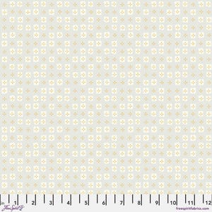 May include: A white fabric with a repeating pattern of small, light yellow squares with a plus sign in the center. The fabric is shown with a ruler for scale.
