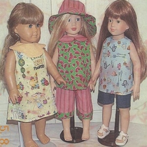 May include: Three dolls wearing different outfits. The doll on the left is wearing a yellow dress with a green and white pattern. The doll in the middle is wearing a green and white watermelon print top and pink and white striped pants. The doll on the right is wearing a blue and white patterned top and blue denim shorts.