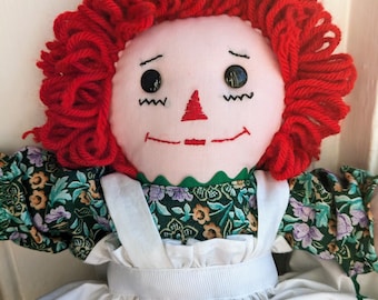 Handmade Raggedy Ann doll with calico dress, apron, and bloomers