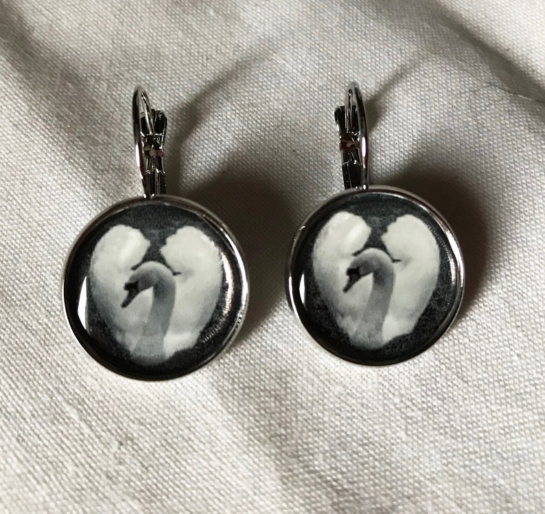 Earrings with a black and white photo of a swan. image 1