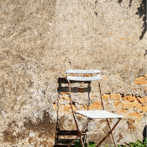 Photo (digital download) of a French bistro chair against an old wall (Colméry, France)