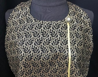 Adult Women's Bibs by Classy Clothing Covers to protect your clothing from accidental spills. Black with gold pattern and button accent.