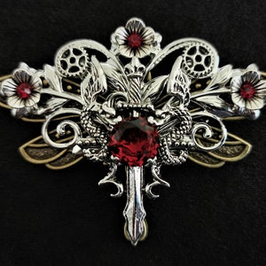 Gorgeous Gothic Steampunk pin brooch with silver dragons, sword, flowers, and red crystal rhinestones