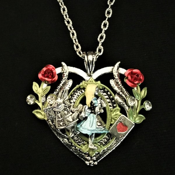 Hand-painted Alice in Wonderland-inspired heart-shaped pendant necklace with Alice, White Rabbit, and Ace of Hearts playing card charms