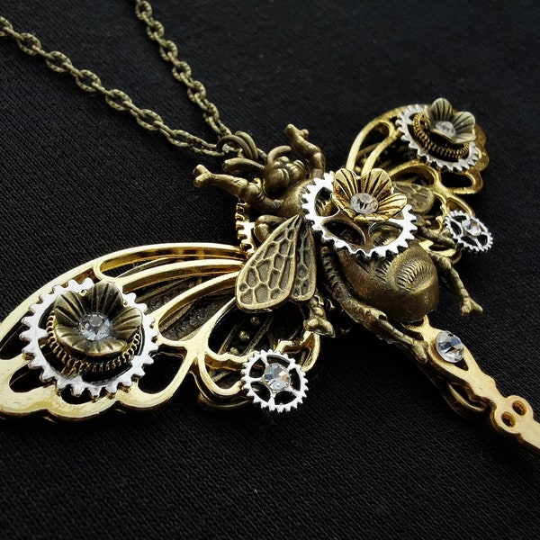 Queen Bee pendant necklace with bronze bee, dragonfly, golden butterfly wings, clock hand, diamante crystals and Steampunk mechanical gears