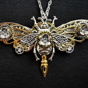 Beautiful Steampunk Queen Bee pendant necklace with silver queen bee and dragonfly, golden butterfly wings & pen nib, + rhinestone crystals