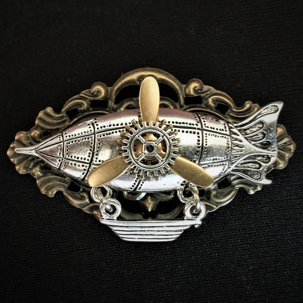 Steampunk jewellery - Fantasy silver airship zeppelin pin badge brooch with bronze base, golden propeller and silver & bronze mini cog gears