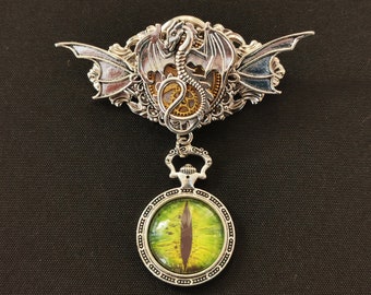 NEW! - Fantasy Steampunk Gothic Goth Year of the Dragon pin brooch medal with winged silver dragon & green eye in pocket watch-style case