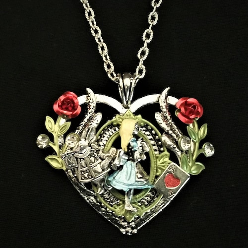 Hand-painted Alice in Wonderland-inspired heart-shaped pendant necklace with Alice, White Rabbit, and Ace of Hearts playing card charms