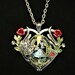 Hand-painted Alice in Wonderland-inspired heart-shaped pendant necklace with Alice, White Rabbit, and Ace of Hearts playing card charms 