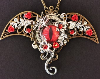 NEW! - Fantasy Gothic Steampunk dragon eye pendant necklace with bronze filigree wings, red dragon eye and curled silver dragon