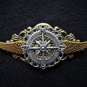 Steampunk Airman Aviator Pilot Explorer Pin Badge and Brooch - Winged flying travel lover's pin badge brooch featuring silver compass charm