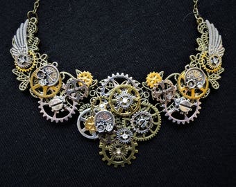 Beautiful Steampunk necklace with bronze, gold, copper, and silver gears, cogs, mini pocket watches and wings + rhinestone diamante crystals