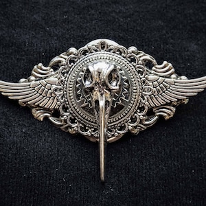 Winged Raven Skull Brooch: Gothic Steampunk Pin Badge. Silver wings and gears