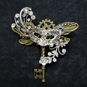 Romantic Steampunk pin brooch - Fairytale Masquerade Mardi Gras Masked Ball Cinderella Bronze key with silver mask and bronze dragonfly