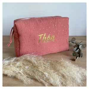Double cotton gauze toiletry bag in marsala, terracotta, gold polka dots. Baby care.