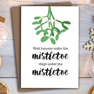 Christmas Card - What happens under the mistletoe, stays under the mistletoe