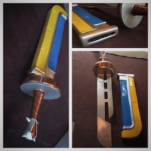 May include: A silver sword with a yellow and blue handle and a matching scabbard. The sword has a decorative design on the handle and a pointed tip.