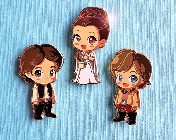 Featured listing image: Chibi Yavin Medal Ceremony Han, Leia. & Luke pins