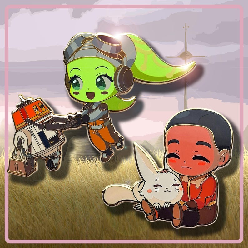 May include: Three enamel pins featuring cartoon characters. One pin shows a green-skinned character with goggles and a droid. Another pin depicts a person with a white rabbit. The background is a field with a cross.
