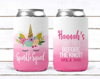 May include: Two pink and white can coolers with a unicorn design and the text "Sparkle Squad" on one and "Hannah's Last Trot Before The Knot! NOLA 2019" on the other.