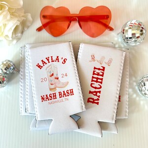 May include: White foam can coolers with red text and a design of cowboy boots. The text reads "Kayla's 20 24 Nash Bash Nashville, TN" and "Rachel".