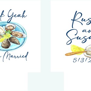 May include: Two wedding announcement cards. The left card features a blue plate with oysters and the text "Shuck Yeah They're Married". The right card features a blue and white illustration of an oyster with a lemon wedge and the text "Russ and Susan 5/31/25".