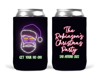 May include: Two black can coolers with neon designs. One cooler features a neon Santa Claus with the text "Get Your Ho On!" The other cooler features the text "The Robinson's Christmas Party San Antonio 2022".