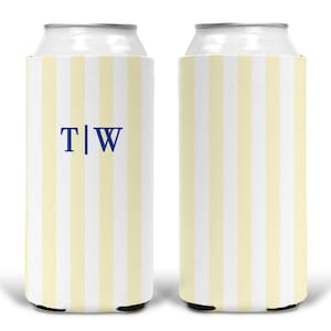 May include: Two cylindrical foam can coolers featuring a vertical striped pattern in pale yellow and white. One cooler displays the blue serif letters T and W separated by a vertical line. The design is consistent across both items.